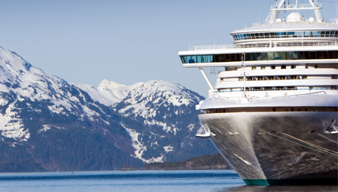 A large cruise ship sailing through the scenic waters