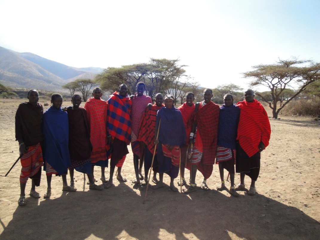 A group of people of various ages standing